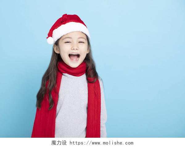 快乐的小女孩在圣诞老人帽子微笑的小女孩